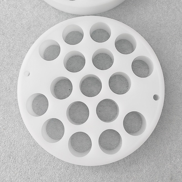 Custom PTFE precision component manufactured by Maisi Precision.
