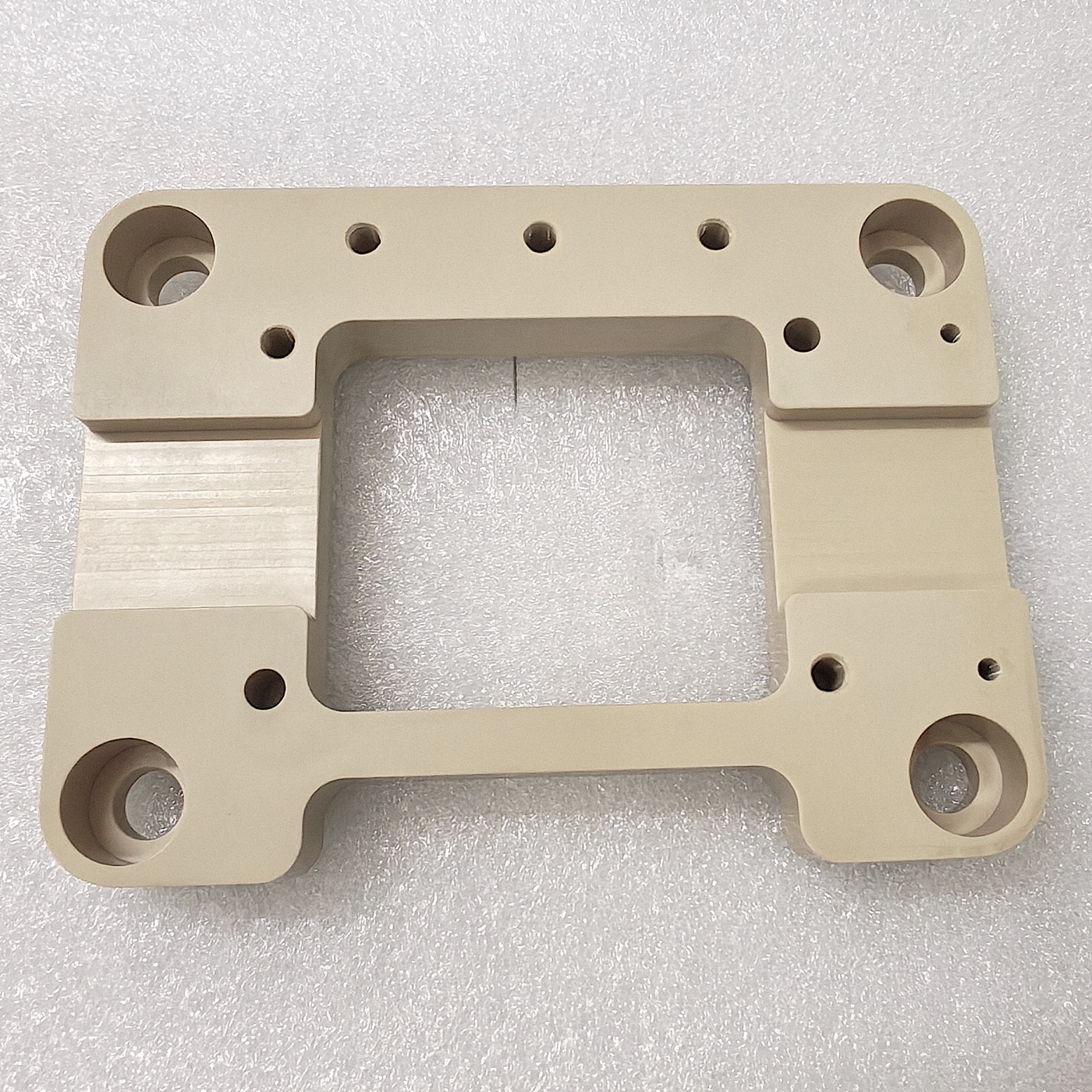 Precision-machined PEEK support frame
